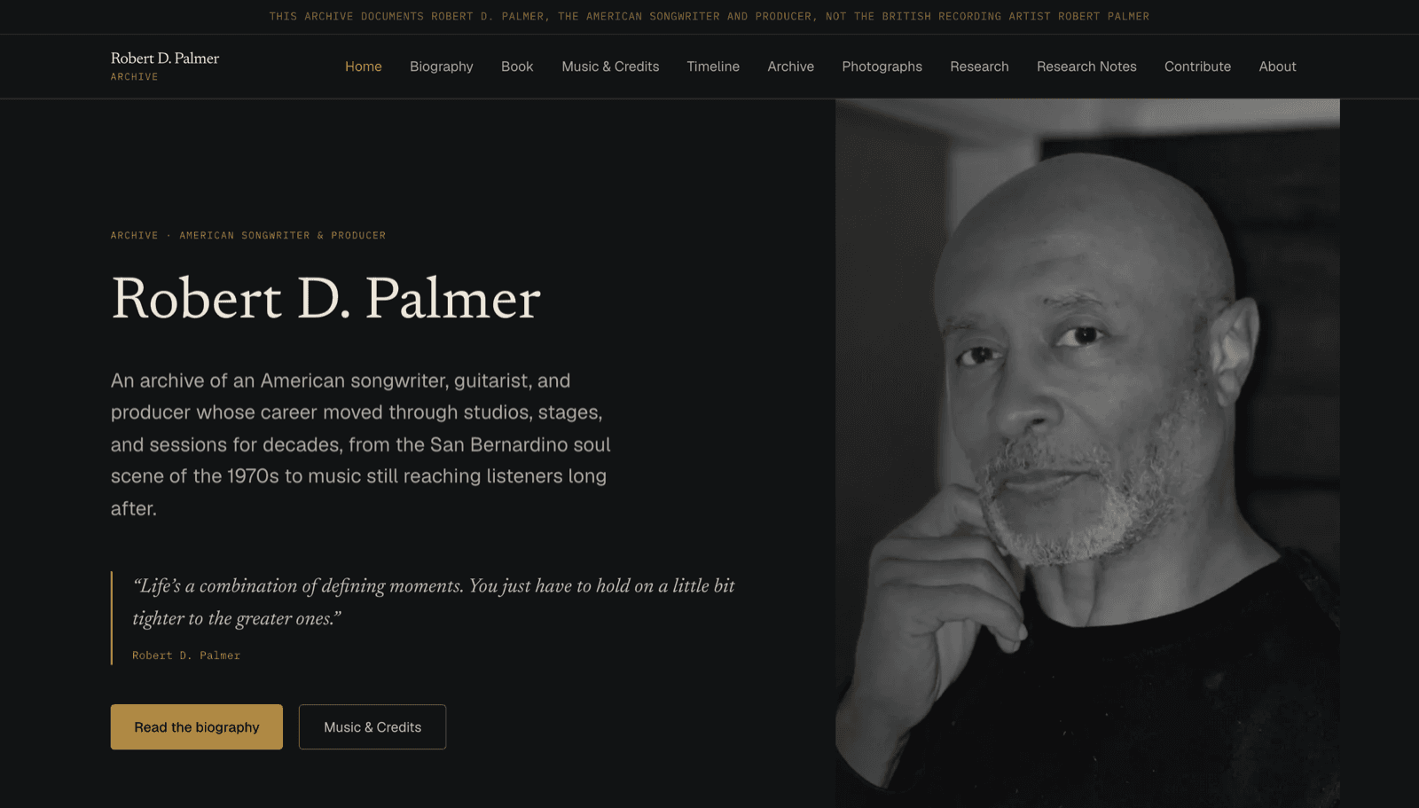 Robert D. Palmer Legacy Archive homepage, showing the archive title, a black-and-white photograph, and a disambiguation banner distinguishing him from the unrelated British recording artist Robert Palmer.